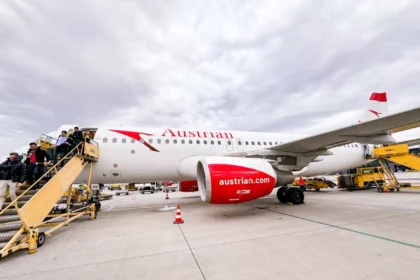 Austrian Airlines Airbus A320 OE-LXD parked at Vienna with passengers descending mobile stairs, in an archive photograph