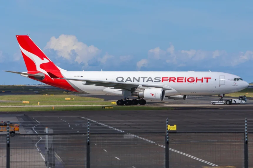 Archive Qantas Freight Airbus A330 VH-EBE with a tug at Sydney Airport, April 2025.