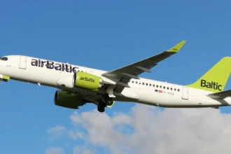 Archive airBaltic Airbus A220-300 YL-AAQ in flight, photographed in December 2019.