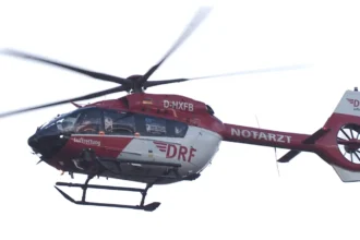 Archive DRF Luftrettung H145 D-HXFB in flight, showing the five-bladed rotor and enclosed tail rotor.