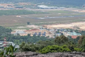 Phu Quoc International Airport viewed from a rocky overlook