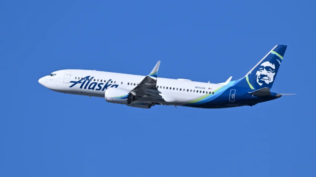 Archive Alaska Airlines Boeing 737 MAX 8 N813AK climbing after departure from Boston in July 2026.