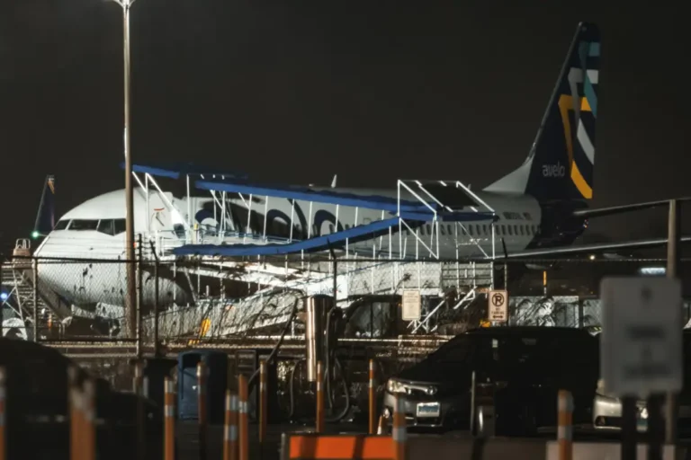 Avelo Boeing 737 parked at Tweed New Haven at night in March 2024, archive photograph