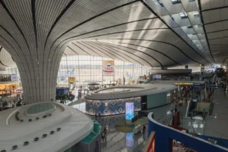 Curved terminal roof and passenger concourses inside Beijing Daxing International Airport
