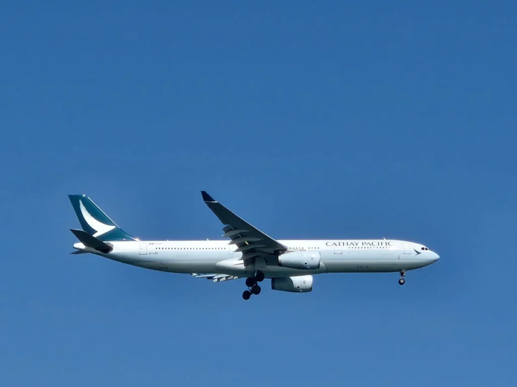 Archive Cathay Pacific A330-300 in flight with landing gear extended, February 2025.
