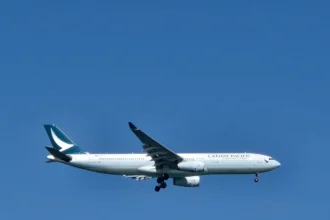 Archive Cathay Pacific A330-300 in flight with landing gear extended, February 2025.