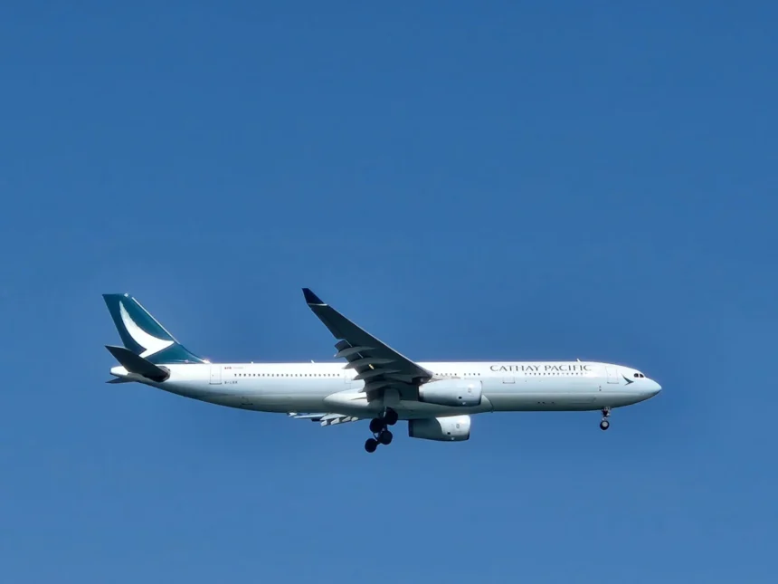 Archive Cathay Pacific A330-300 in flight with landing gear extended, February 2025.