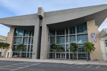Exterior of Guam airport terminal with palm trees