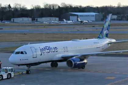JetBlue Airbus A320 N571JB with an airport tug at Westchester in March 2023, archive photograph
