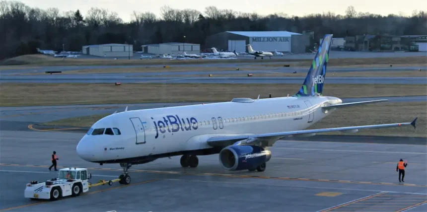 JetBlue Airbus A320 N571JB with an airport tug at Westchester in March 2023, archive photograph