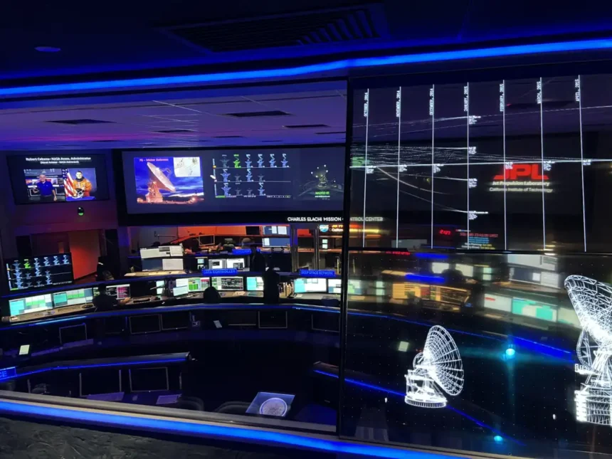 Archive view of JPL Mission Control with consoles and large wall displays in January 2023
