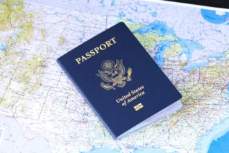 United States passport resting on a map, an archive travel illustration