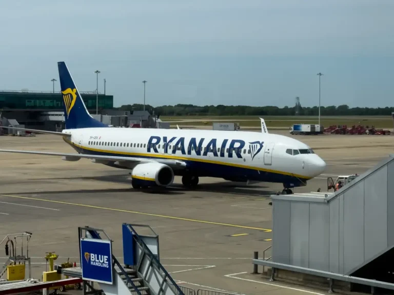 Ryanair Boeing 737 parked beside terminal boarding equipment at London Stansted Airport